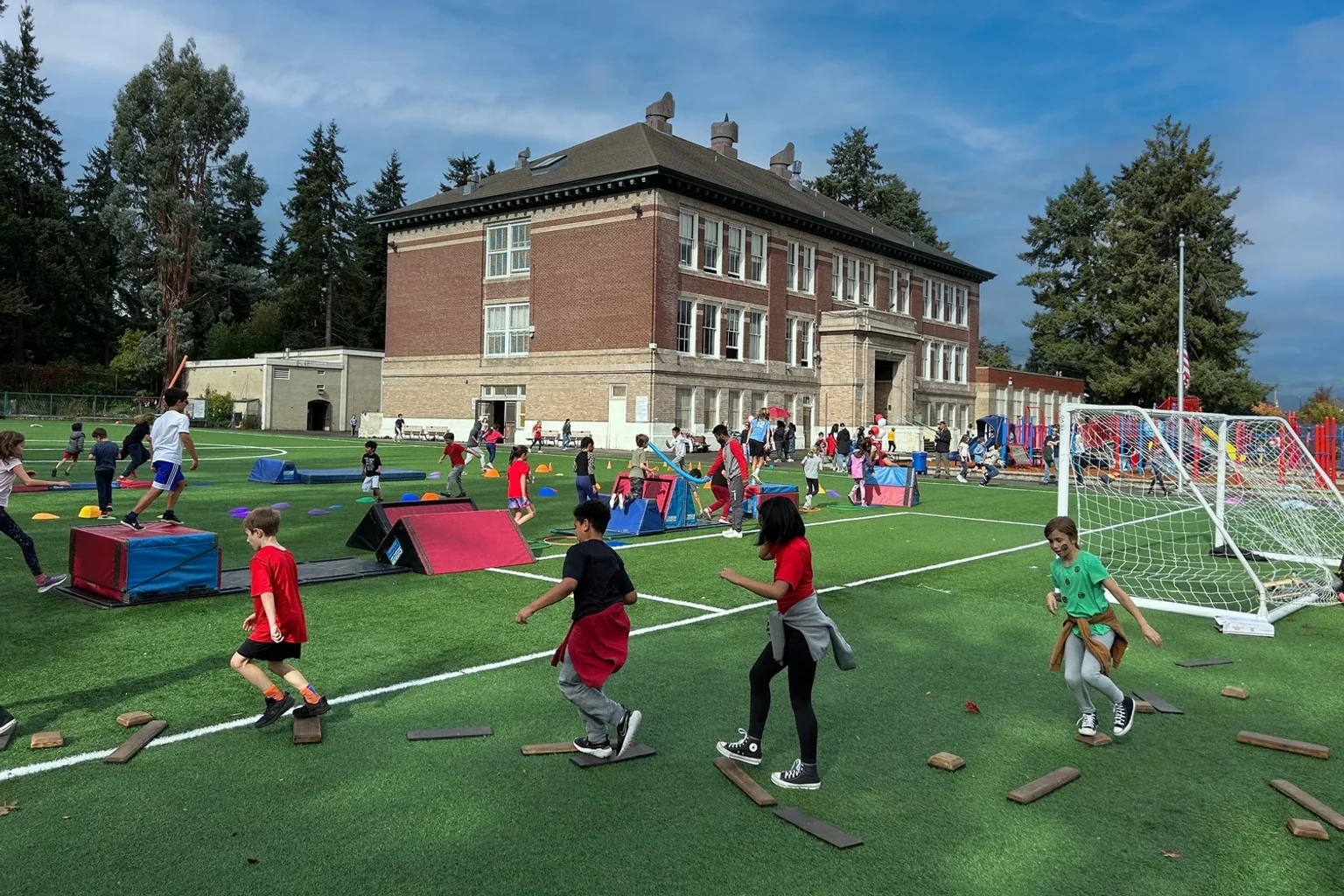 Children enjoying community activities on McGilvra’s playing field